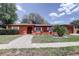 Inviting home with manicured lawn, walkway, and welcoming front entrance at 7117 Wrenwood Cir, Tampa, FL 33617