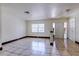 Bright living space featuring tile flooring, natural light, and an open layout at 7117 Wrenwood Cir, Tampa, FL 33617