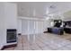 Large living room with fireplace, sliding doors, and open access to the kitchen at 7117 Wrenwood Cir, Tampa, FL 33617