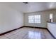 Inviting room featuring tile flooring and ample natural light from a large window at 7117 Wrenwood Cir, Tampa, FL 33617