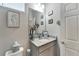 Elegant powder room featuring granite countertops and modern fixtures at 7423 Sungold Meadow Ct, Apollo Beach, FL 33572