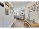 Hallway with art leading into an open floorplan with a view of the kitchen and dining area at 7423 Sungold Meadow Ct, Apollo Beach, FL 33572