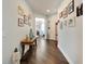 Hallway view with decor leading into other rooms of the house, and wooden flooring at 7423 Sungold Meadow Ct, Apollo Beach, FL 33572