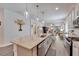 Open concept kitchen featuring granite countertop, stainless steel appliances, and an eat-in bar at 7423 Sungold Meadow Ct, Apollo Beach, FL 33572