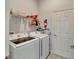 Bright laundry room with modern Samsung washer and dryer at 7423 Sungold Meadow Ct, Apollo Beach, FL 33572