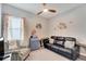 Cozy living room featuring stylish furniture, decor and a ceiling fan at 7423 Sungold Meadow Ct, Apollo Beach, FL 33572
