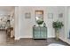 Bright living room area with lovely decor, art, and stylish wooden floors at 7423 Sungold Meadow Ct, Apollo Beach, FL 33572
