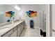 Spa-like main bathroom with a double sink vanity, granite countertops and a glass-enclosed shower at 7423 Sungold Meadow Ct, Apollo Beach, FL 33572