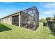 Outdoor living with the covered patio and well-manicured lawn at 7423 Sungold Meadow Ct, Apollo Beach, FL 33572