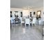 Bright dining area with a glass table, comfortable seating, and elegant decor, perfect for gatherings at 7465 Bay Island S Dr # 312, South Pasadena, FL 33707