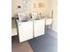 Community laundry room with two washing machines, sink, and available signage at 7465 Bay Island S Dr # 312, South Pasadena, FL 33707