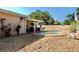 Well-maintained backyard with a refreshing pool, patio space, and charming landscaping for outdoor enjoyment at 8039 83Rd N St, Seminole, FL 33777