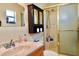 Bathroom with a walk-in shower, vanity, and ample storage, providing comfort and functionality at 8039 83Rd N St, Seminole, FL 33777