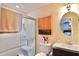 Bathroom with a shower-tub combo, vanity, and a large mirror, providing a bright and fresh space at 8039 83Rd N St, Seminole, FL 33777