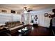 Spacious living room with hardwood floors, a cozy sofa, and ample natural light from large windows at 8039 83Rd N St, Seminole, FL 33777