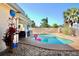 Beautiful pool area with lush greenery and seating at 8039 83Rd N St, Seminole, FL 33777