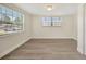Bedroom features two windows and wood flooring at 918 Skyview Dr, Brandon, FL 33510
