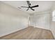 Bedroom with fan, wood floor, closet, and one window at 918 Skyview Dr, Brandon, FL 33510