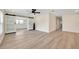 Living room featuring light wood floors and sliding barn doors, creating a modern and flexible space at 918 Skyview Dr, Brandon, FL 33510