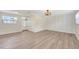 Bright living room with light wood floors, offering a spacious and versatile living area at 918 Skyview Dr, Brandon, FL 33510
