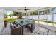 Inviting sun room features tile floors and a glass table, perfect for enjoying outdoor views at 918 Skyview Dr, Brandon, FL 33510