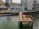 Aerial view featuring the charming waterfront home and private wooden dock at 94 Devon Dr, Clearwater Beach, FL 33767
