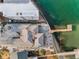 Aerial view showcasing home, private dock, and waterfront location with easy ocean access at 94 Devon Dr, Clearwater Beach, FL 33767