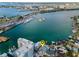 Waterfront home with dock, boat lift, and expansive views of the bay and marina at 94 Devon Dr, Clearwater Beach, FL 33767