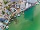 A stunning aerial view of waterfront homes with private docks and boat access on a serene waterway at 94 Devon Dr, Clearwater Beach, FL 33767