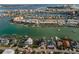 An aerial view showcases waterfront homes with private boat docks and serene water views at 94 Devon Dr, Clearwater Beach, FL 33767