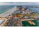 Panoramic aerial view of a beachside community with high-rise buildings and waterfront activities at 94 Devon Dr, Clearwater Beach, FL 33767