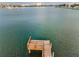 Private dock extends into the tranquil water, perfect for boating and enjoying waterfront living at 94 Devon Dr, Clearwater Beach, FL 33767