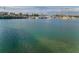 Picturesque view of a harbor with boats and the waterfront buildings in the background at 94 Devon Dr, Clearwater Beach, FL 33767