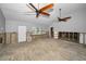 Open living room with ceiling fans, a large window, and ready for your creative design at 94 Devon Dr, Clearwater Beach, FL 33767