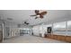 Open living room with a waterfront view featuring ceiling fans and lots of light at 94 Devon Dr, Clearwater Beach, FL 33767