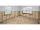 Awaiting renovation, bright room with windows ready for new flooring and finishes at 94 Devon Dr, Clearwater Beach, FL 33767