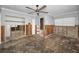 Large room featuring an open doorway to another room with exposed framing and concrete floor at 94 Devon Dr, Clearwater Beach, FL 33767