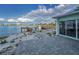 Breathtaking waterfront patio boasts serene water views and private dock access at 94 Devon Dr, Clearwater Beach, FL 33767