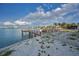 Breathtaking waterfront patio boasts serene water views and private dock access at 94 Devon Dr, Clearwater Beach, FL 33767