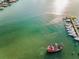 Picturesque waterfront scene featuring a pirate ship, a marina, and glistening turquoise water at 94 Devon Dr, Clearwater Beach, FL 33767
