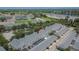 Townhome with a screened-in patio and a detached garage in a well-maintained community at 9506 Harpender Way, Tampa, FL 33626