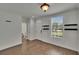 Inviting entryway featuring wood-look tile flooring and a convenient half bathroom nearby at 9506 Harpender Way, Tampa, FL 33626