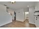 Foyer featuring wood-look flooring with view of the staircase and half-bath at 9506 Harpender Way, Tampa, FL 33626