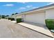 Attached garages lined with manicured hedges in a desirable community at 9506 Harpender Way, Tampa, FL 33626