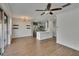 Open-concept living space with combined dining area, modern lighting, and kitchen view at 9506 Harpender Way, Tampa, FL 33626