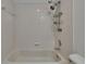 Shower/tub combination with tile surround and shower head with shelves at 9506 Harpender Way, Tampa, FL 33626