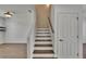 Elegant staircase with hardwood steps, connecting the home's levels at 9506 Harpender Way, Tampa, FL 33626