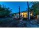 The back yard offers a wooden deck, mature trees, and a quaint and serene outdoor living space at 9812 N Pawnee Ave, Tampa, FL 33617