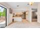 Bright kitchen with stainless steel appliances and sliding door access to outdoor living at 9812 N Pawnee Ave, Tampa, FL 33617