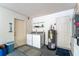 Functional laundry area features washer, dryer, and convenient storage space at 9812 N Pawnee Ave, Tampa, FL 33617